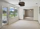 Bright Gathering room with french doors leading to backyard at 716 Fox Hills Dr, Sun City Center, FL 33573