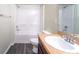 Clean bathroom featuring a tub, toilet, and vanity with a large mirror at 9031 Sienna Moss Ln, Riverview, FL 33578