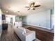 Bright living room with ceiling fan and grey vinyl plank flooring at 9031 Sienna Moss Ln, Riverview, FL 33578