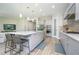 Modern kitchen with gray cabinets, large island, and stainless steel appliances at 291 Mossy River Ct, Brandon, FL 33511