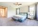 Primary bedroom with a king-size bed and ensuite bathroom access at 291 Mossy River Ct, Brandon, FL 33511