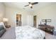 Bedroom with a king-size bed, TV mount, and carpet flooring at 291 Mossy River Ct, Brandon, FL 33511