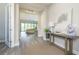 Bright and airy entryway with wood-look floors, leading to living areas at 291 Mossy River Ct, Brandon, FL 33511