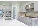 Modern kitchen with stainless steel appliances and a large island at 291 Mossy River Ct, Brandon, FL 33511