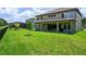 Private backyard with patio and plenty of green space at 291 Mossy River Ct, Brandon, FL 33511