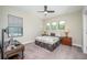 Bedroom with a queen-size bed, window, and carpet flooring at 291 Mossy River Ct, Brandon, FL 33511