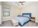 Bedroom with a queen-size bed and blue bedding set at 291 Mossy River Ct, Brandon, FL 33511