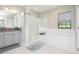 Spa-like bathroom with a soaking tub, walk-in shower, and updated fixtures at 291 Mossy River Ct, Brandon, FL 33511