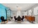 Elegant dining room features a unique wallpaper and mid-century modern furniture at 200 Colony Point S Rd, St Petersburg, FL 33705