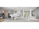 Living room with grand piano and view to entryway at 200 Colony Point S Rd, St Petersburg, FL 33705