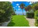 Landscaped waterfront pathway to private dock at 200 Colony Point S Rd, St Petersburg, FL 33705