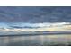 Dramatic clouds over calm water with distant bridge at 200 Colony Point S Rd, St Petersburg, FL 33705