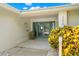 Modern entryway with teal double doors and landscaping at 200 Colony Point S Rd, St Petersburg, FL 33705