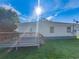 Exterior view of the house, showcasing the deck and yard at 5015 17Th St, Zephyrhills, FL 33542