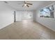 Bright living room with tile flooring and neutral walls at 2413 Riverbluff Pkwy # V-231, Sarasota, FL 34231