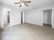 Large bedroom with tile floors and access to bathroom at 2413 Riverbluff Pkwy # V-231, Sarasota, FL 34231