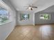 Open dining room with tile floors and exterior access at 2413 Riverbluff Pkwy # V-231, Sarasota, FL 34231