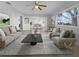 Spacious living room with neutral decor and a view to dining area at 2413 Riverbluff Pkwy # V-231, Sarasota, FL 34231