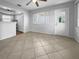 Bright dining area with tile floors and kitchen access at 2413 Riverbluff Pkwy # V-231, Sarasota, FL 34231