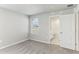 Bright bedroom featuring carpet, a window, and an ensuite bath at 7659 Momentum Pkwy, Wesley Chapel, FL 33545