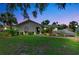 Charming single-story home with covered carport and well-manicured lawn at 3228 Hercules Rd, Venice, FL 34293