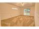 Spacious bedroom with neutral carpeting and sliding glass doors at 2863 Tishman Ave, North Port, FL 34286