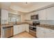 Updated kitchen with stainless steel appliances and granite countertops at 3720 Orangepointe Rd, Valrico, FL 33596