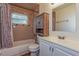 Bathroom with shower/tub combo and updated vanity at 3720 Orangepointe Rd, Valrico, FL 33596