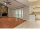 Living room with tile floors, stone fireplace, and french doors at 3720 Orangepointe Rd, Valrico, FL 33596