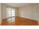 Bedroom with wood-look tile flooring and sliding glass doors at 3720 Orangepointe Rd, Valrico, FL 33596