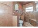 Walk-in shower with tile surround and built-in seat at 3720 Orangepointe Rd, Valrico, FL 33596