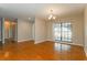 Dining room with wood-look tile flooring and access to patio at 3720 Orangepointe Rd, Valrico, FL 33596