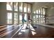 Yoga studio with mirrors and hardwood floors at 8900 Bernini Pl, Sarasota, FL 34240