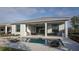 Inviting backyard oasis with a refreshing pool, expansive patio, and outdoor kitchen at 8904 Bernini Pl, Sarasota, FL 34240