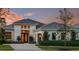 Luxury home with modern architecture and landscaping at 8904 Bernini Pl, Sarasota, FL 34240