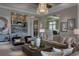 Spacious living room featuring a neutral color palette, comfortable seating, and stylish accents at 8904 Bernini Pl, Sarasota, FL 34240