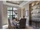 Formal dining room with built-in shelving and stylish chandelier at 8904 Bernini Pl, Sarasota, FL 34240