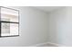 Cozy bedroom with neutral paint, carpet flooring, base trim and a window for natural light at 18324 Rockport Pl, Lakewood Ranch, FL 34211