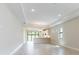 Spacious living room with tile flooring and an open floor plan and access to outdoor living area at 18324 Rockport Pl, Lakewood Ranch, FL 34211
