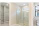 Bathroom with walk-in shower, large mirror, and spacious closet at 18324 Rockport Pl, Lakewood Ranch, FL 34211