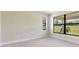 Bright bedroom with large window and neutral colored carpet at 18324 Rockport Pl, Lakewood Ranch, FL 34211