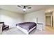 Main bedroom with king-size bed and ceiling fan at 108 Castile Ct, Punta Gorda, FL 33983