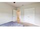 Bedroom with a queen bed, double door closet, and access to the hallway at 108 Castile Ct, Punta Gorda, FL 33983