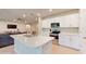 Modern kitchen featuring white cabinets and stainless steel appliances at 108 Castile Ct, Punta Gorda, FL 33983