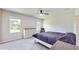 Main bedroom with dresser, king bed and ceiling fan at 108 Castile Ct, Punta Gorda, FL 33983