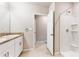 Bathroom with double vanity, shower, and extra space at 108 Castile Ct, Punta Gorda, FL 33983