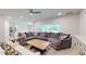 Open living space with sectional sofa and views of the kitchen at 108 Castile Ct, Punta Gorda, FL 33983