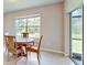 Bright dining room with table and chairs, view of backyard at 108 Castile Ct, Punta Gorda, FL 33983