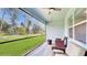 Relaxing screened porch with wicker furniture overlooking the backyard at 108 Castile Ct, Punta Gorda, FL 33983