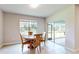 Dining area with round table and four chairs, near sliding door at 108 Castile Ct, Punta Gorda, FL 33983